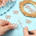 Zawieszki kokardki złote emaliowane 6 szt do biżuterii DIY